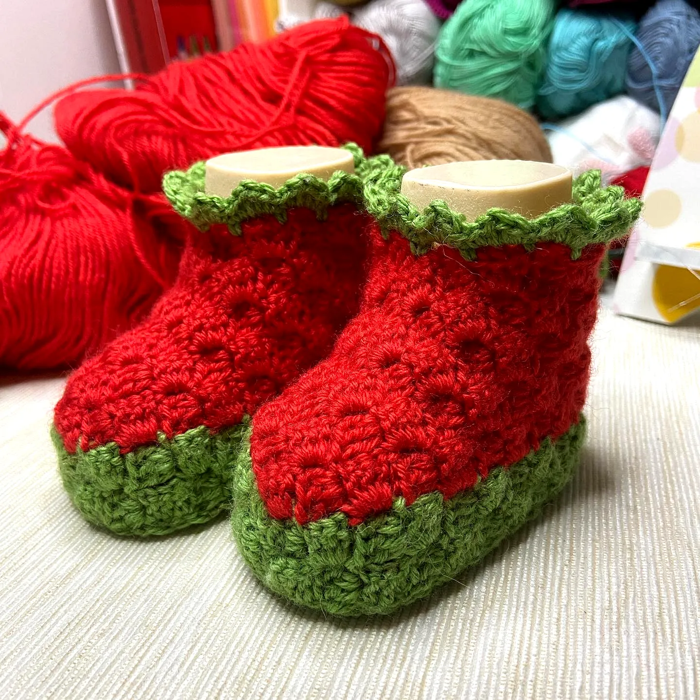 Adorable Crochet Baby Booties in Vibrant Red and Green Style