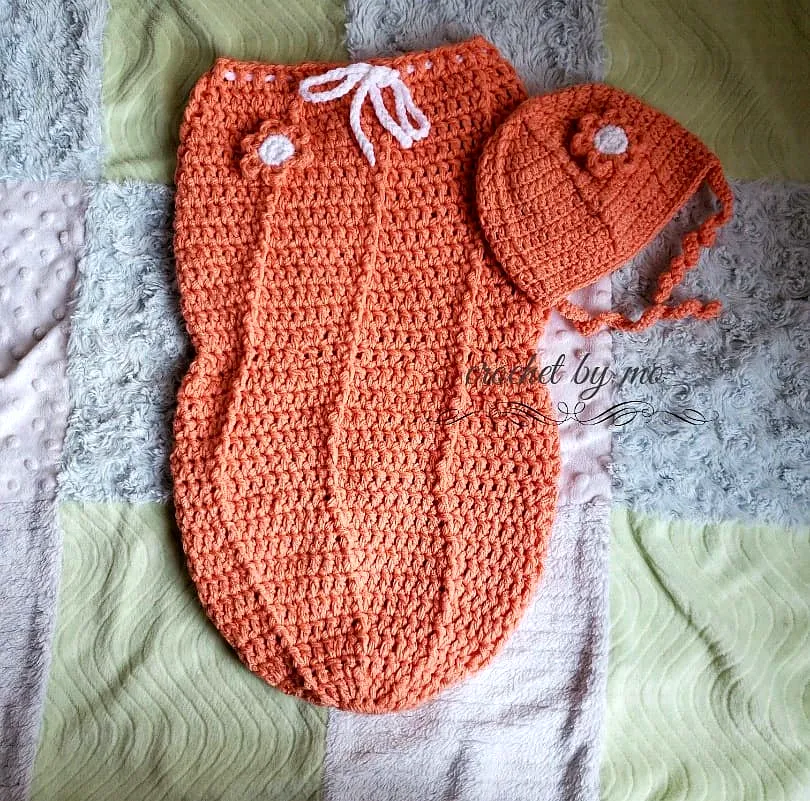 Adorable crochet baby cocoon in soft coral with flower hat