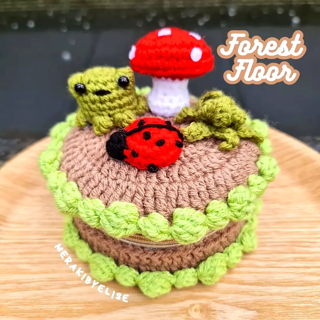 Adorable Crochet Cake Design with Colorful Forest Accents