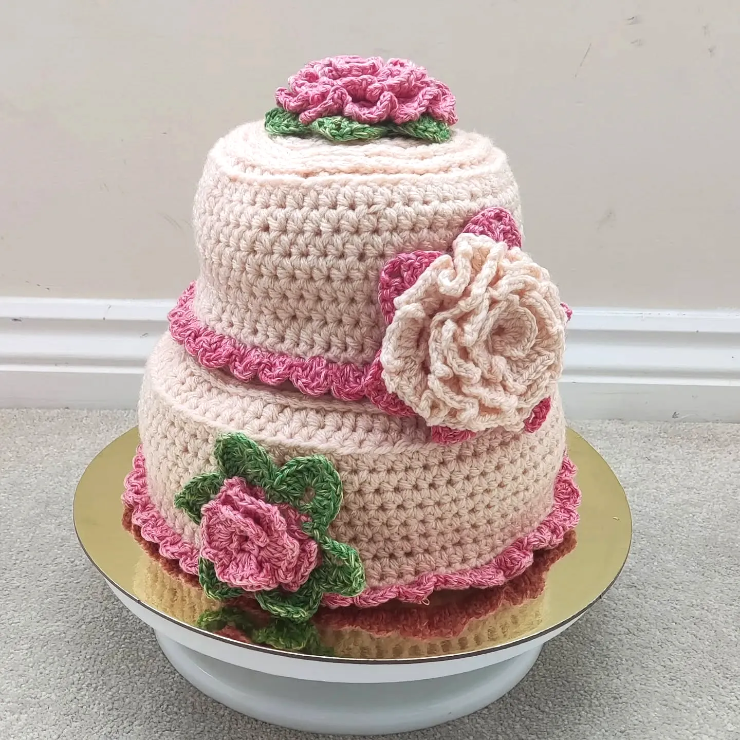 Adorable Crochet Cake in Soft Pink and Cream with Floral Design