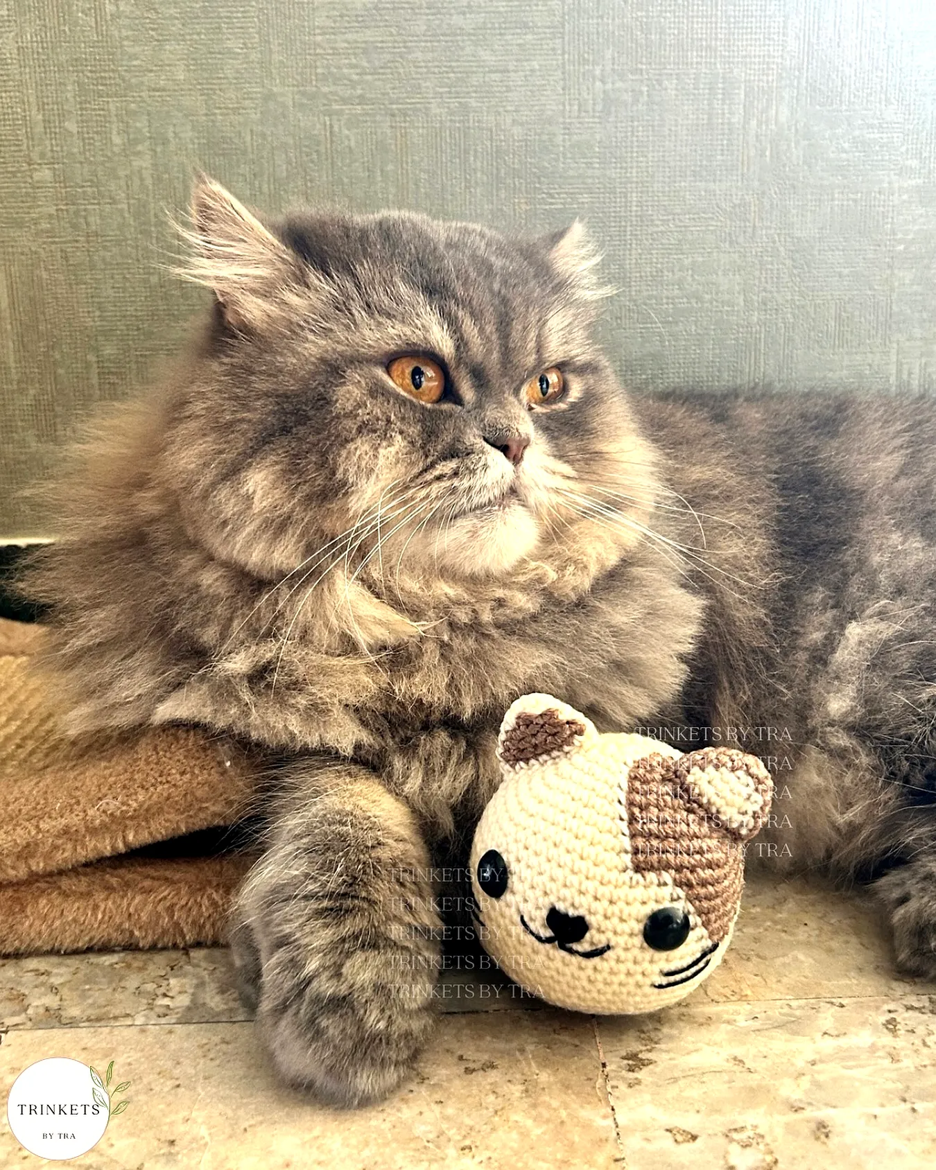 Adorable crochet cat toy in soft brown and cream colors