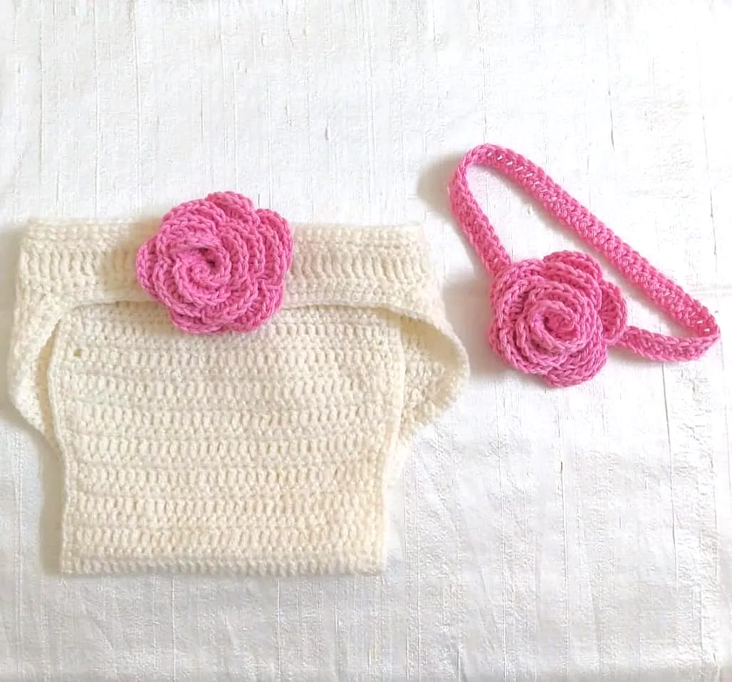 Adorable crochet diaper cover in soft cream with pink florals