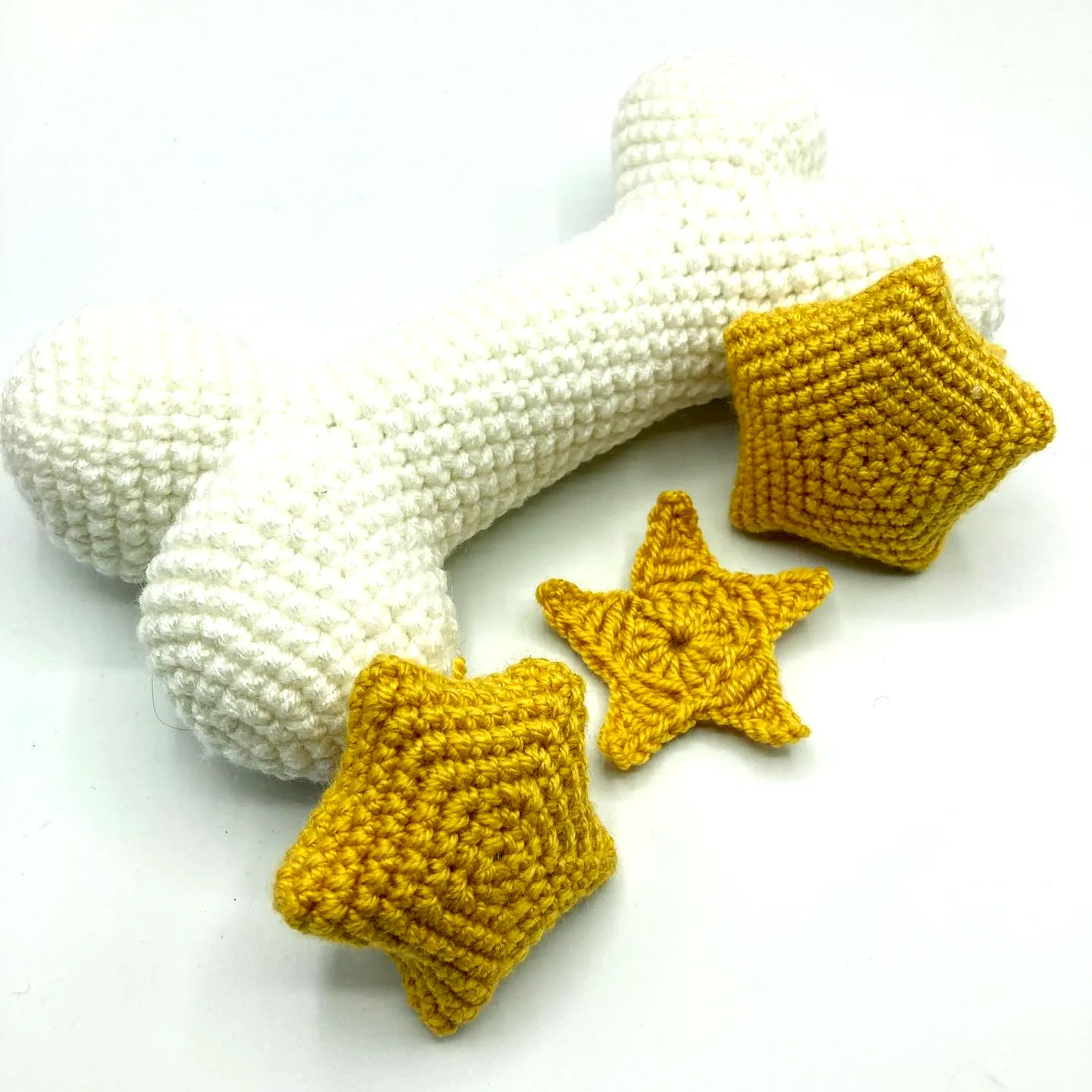 Adorable Crochet Dog Bone Toy in Soft White with Vibrant Stars