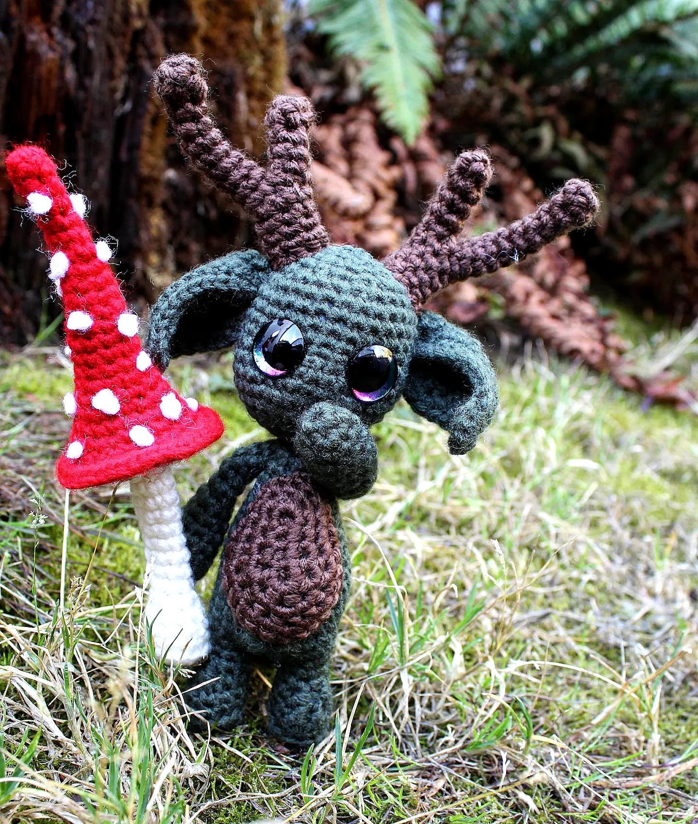 Adorable crochet forest animal with colorful antlers and details