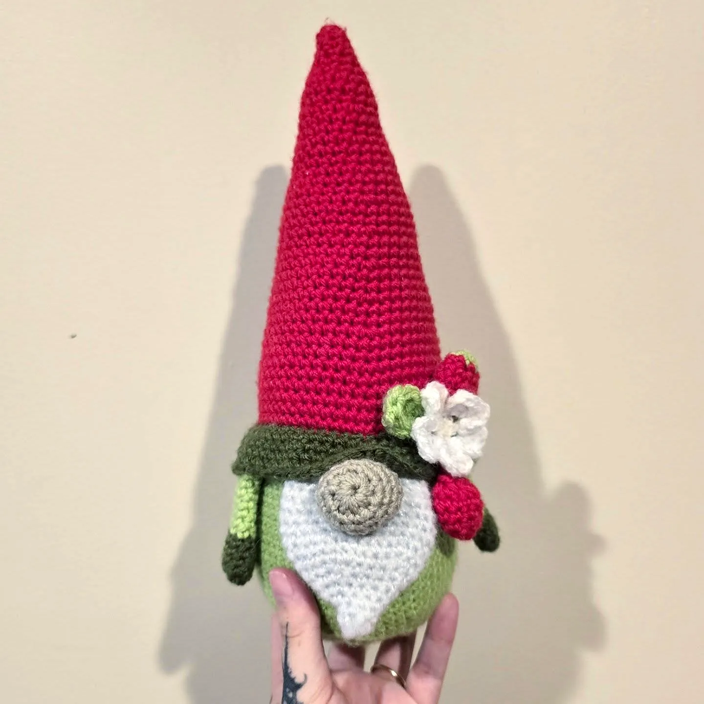 Adorable crochet gnome with red hat and colorful details