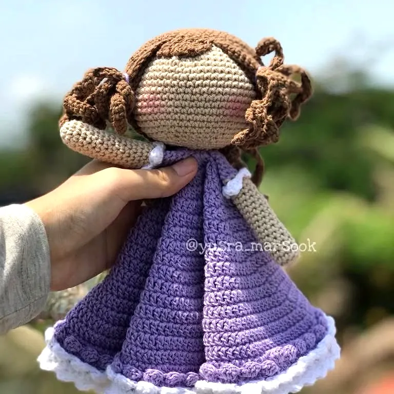 Adorable crochet lovey doll in soft lavender dress