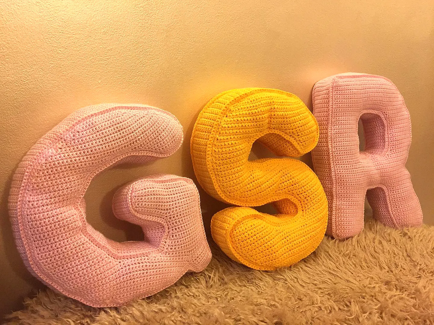 Adorable Crochet Nursery Decor in Soft Pink and Vibrant Yellow