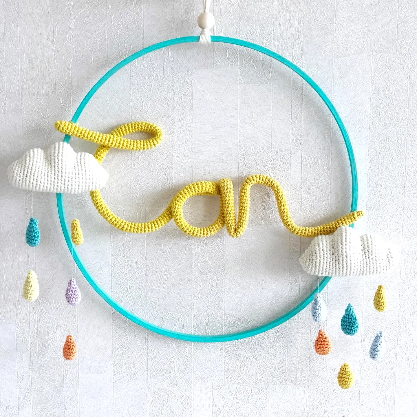 Adorable Crochet Nursery Decor with Colorful Cloud Mobile