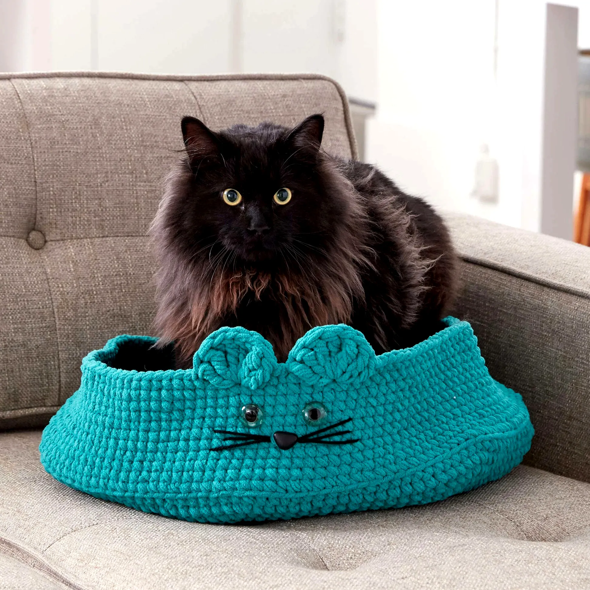 Adorable crochet pet bed in vibrant turquoise with mouse design