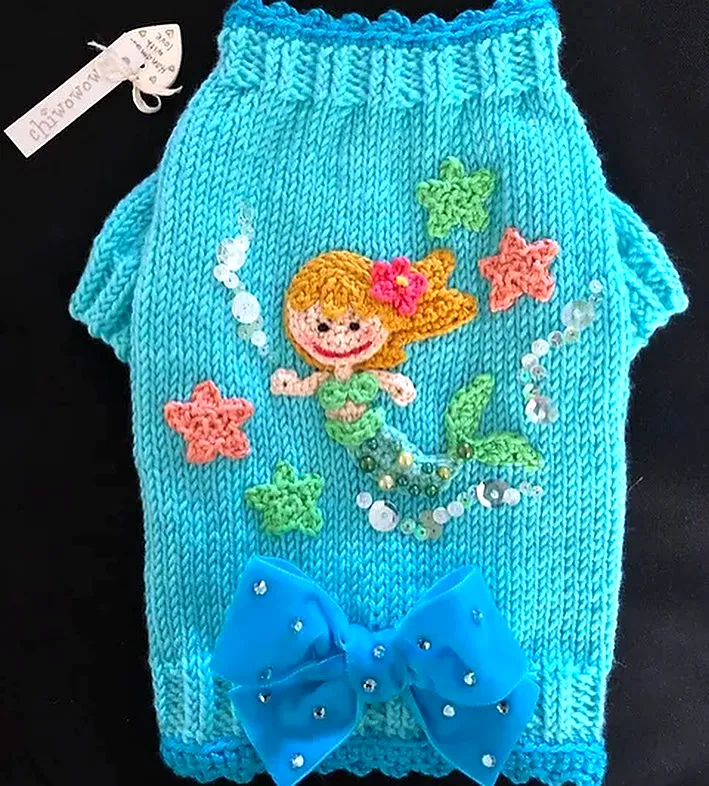 Adorable crochet pet sweater in vibrant turquoise with bow and beads