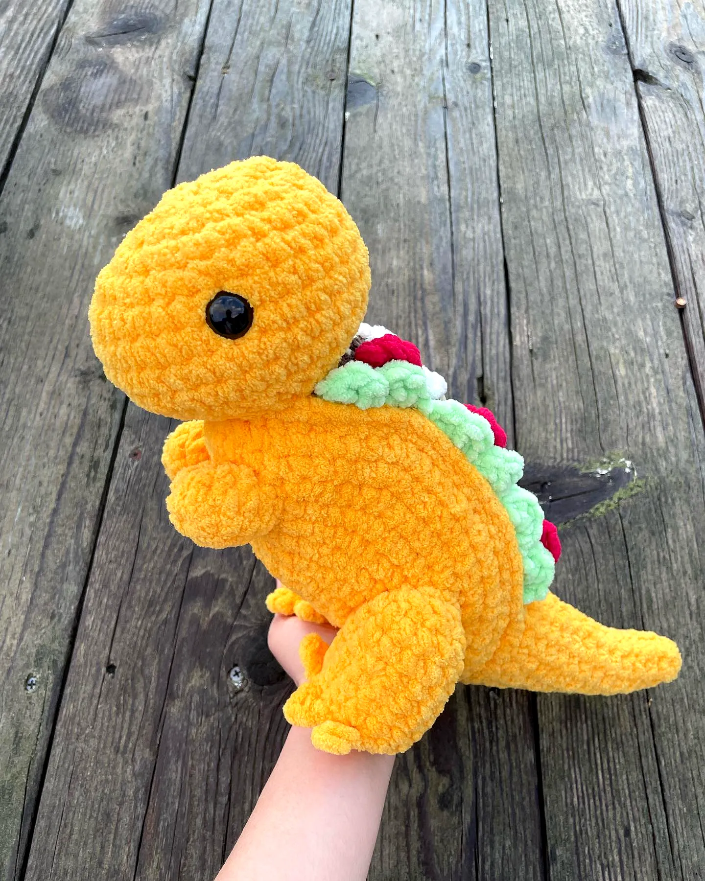 Adorable crochet taco plush with vibrant dinosaur design