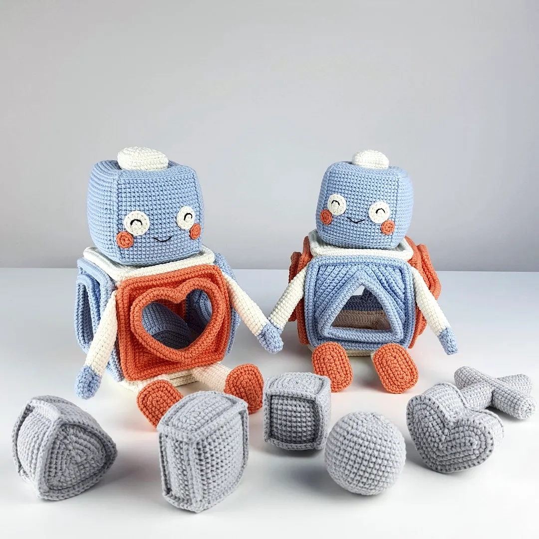 Adorable crochet toy set in pastel blue and orange colors