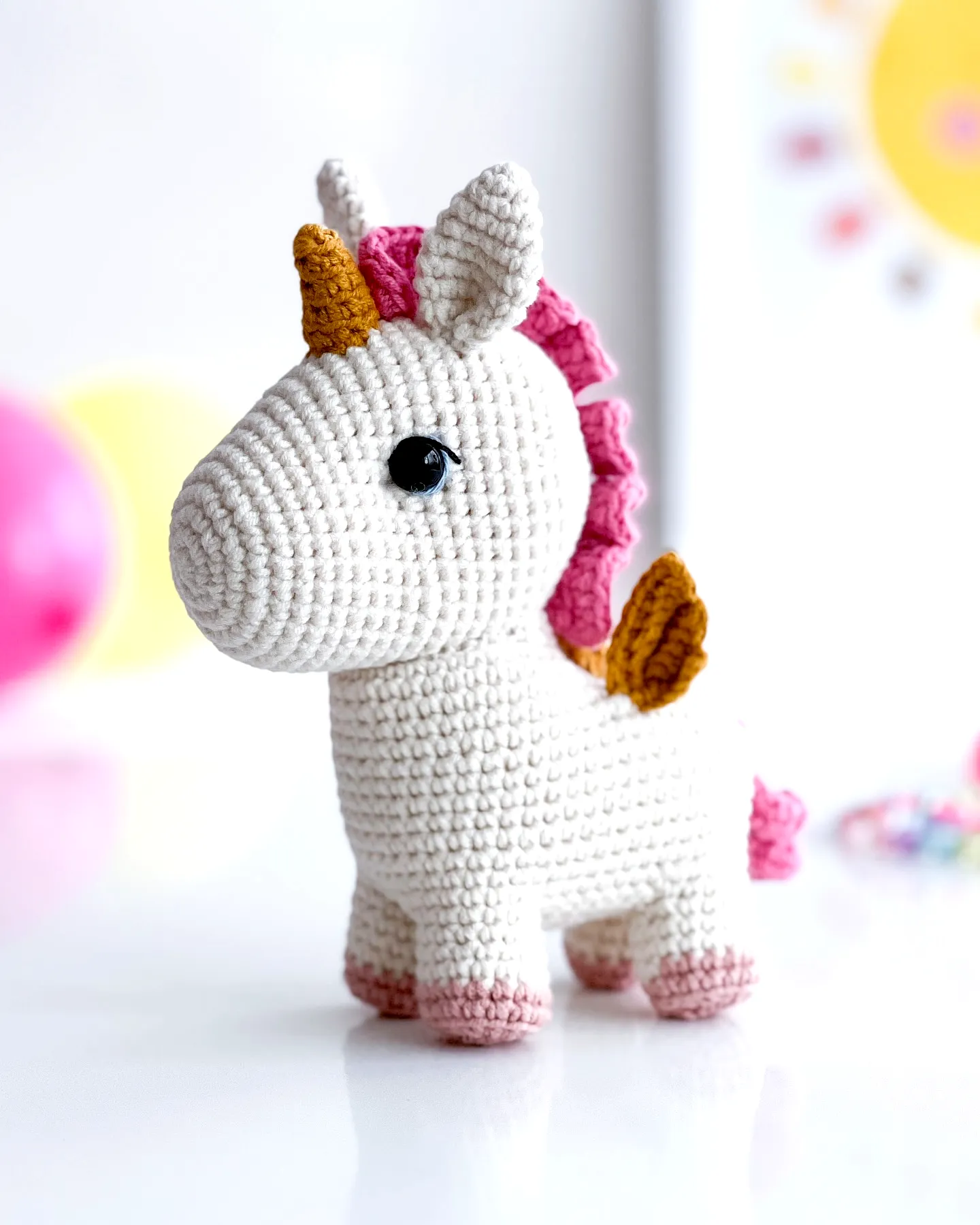 Adorable Crochet Unicorn in Soft White with Pink Accents