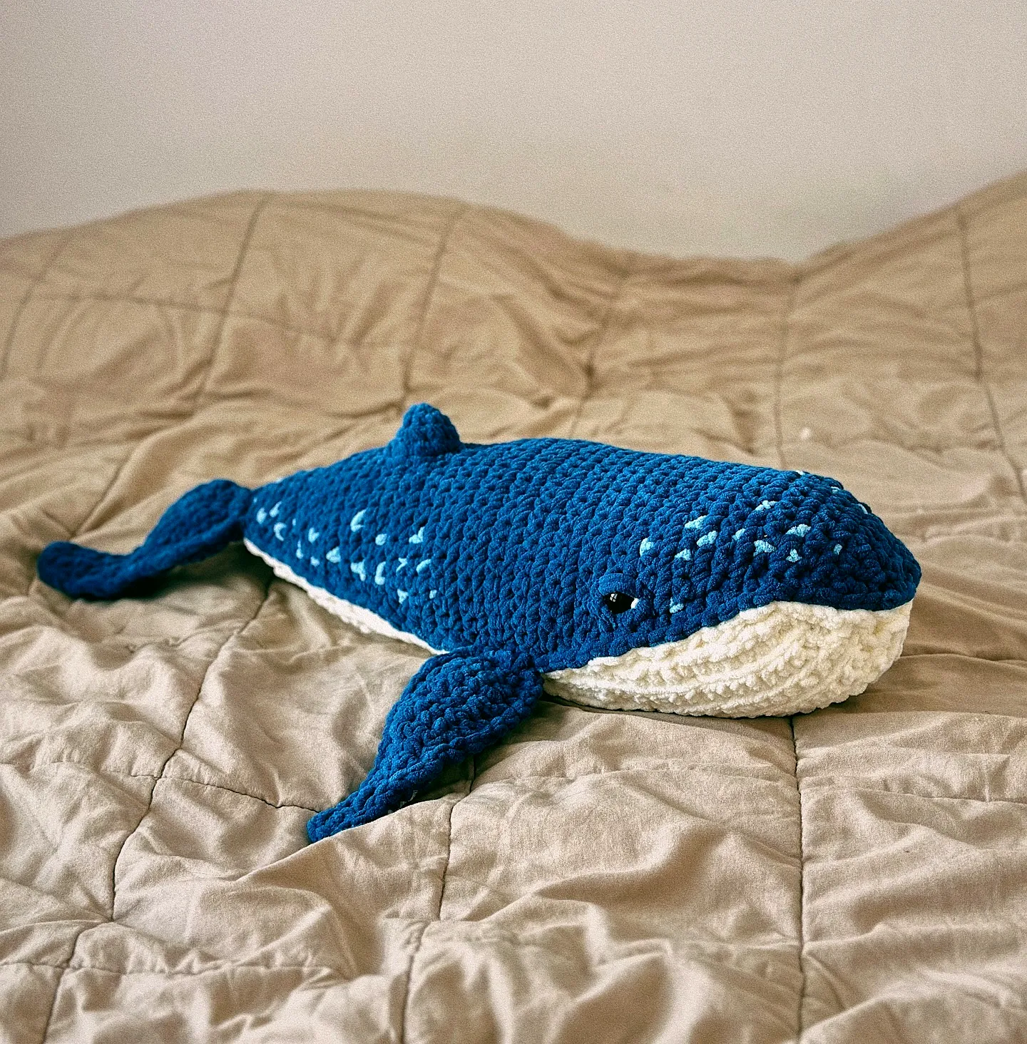 Adorable crochet whale in deep ocean blue with flippers