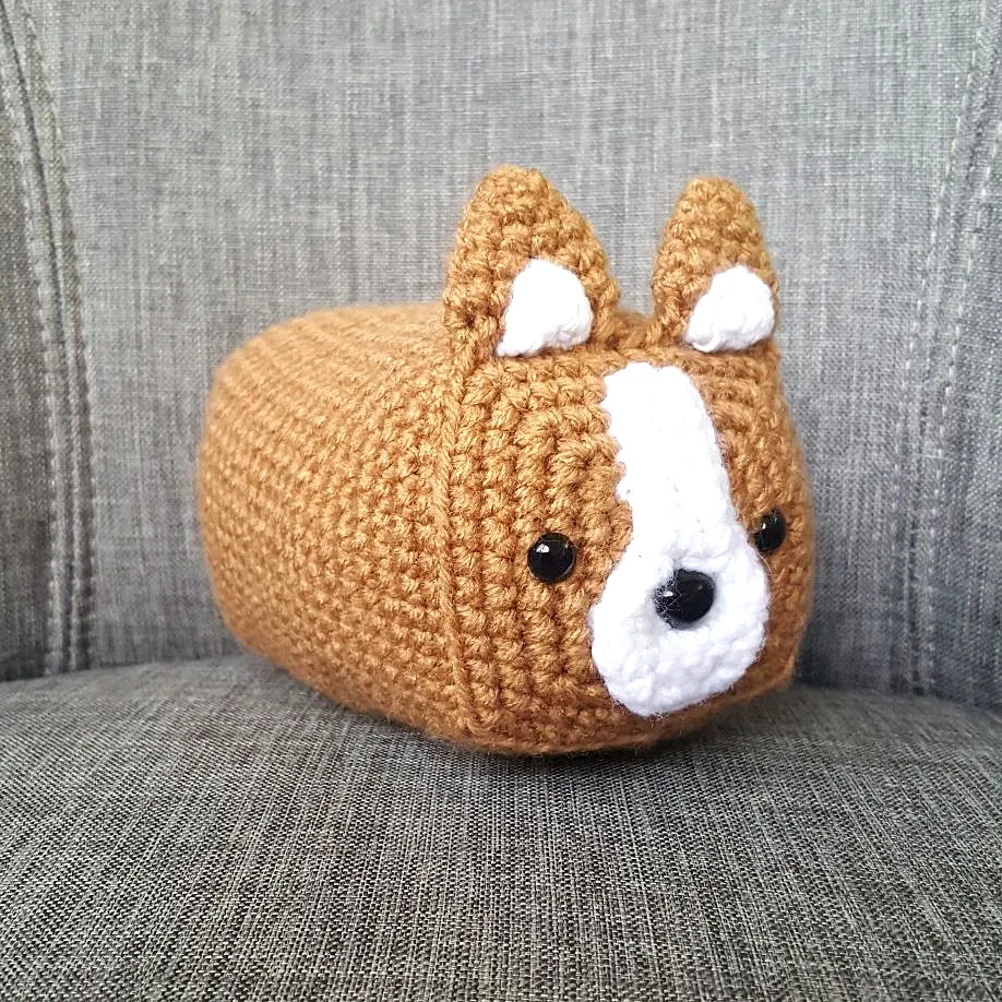 Adorable easy crochet bread loaf dog plush in warm brown color
