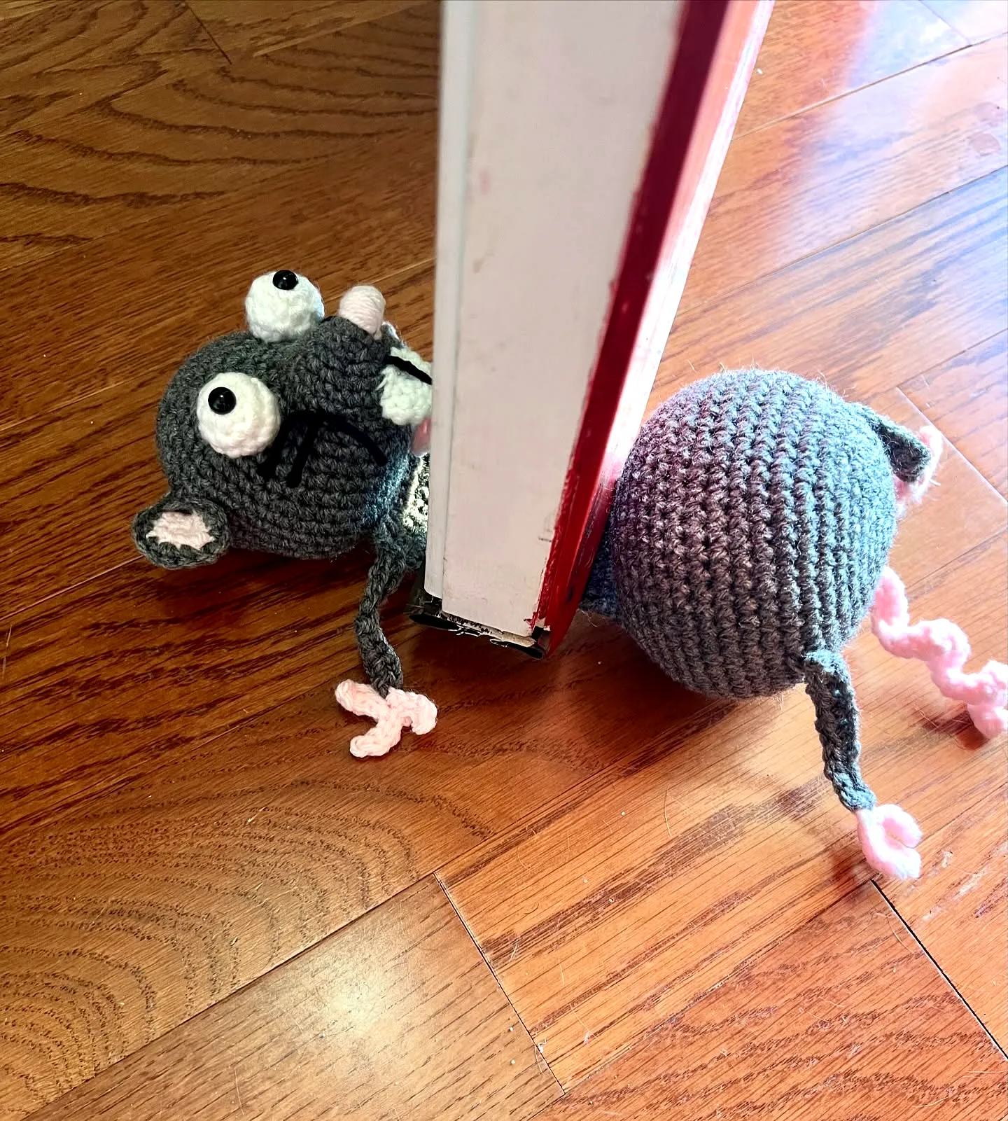 Adorable gray and pink crochet doorstop