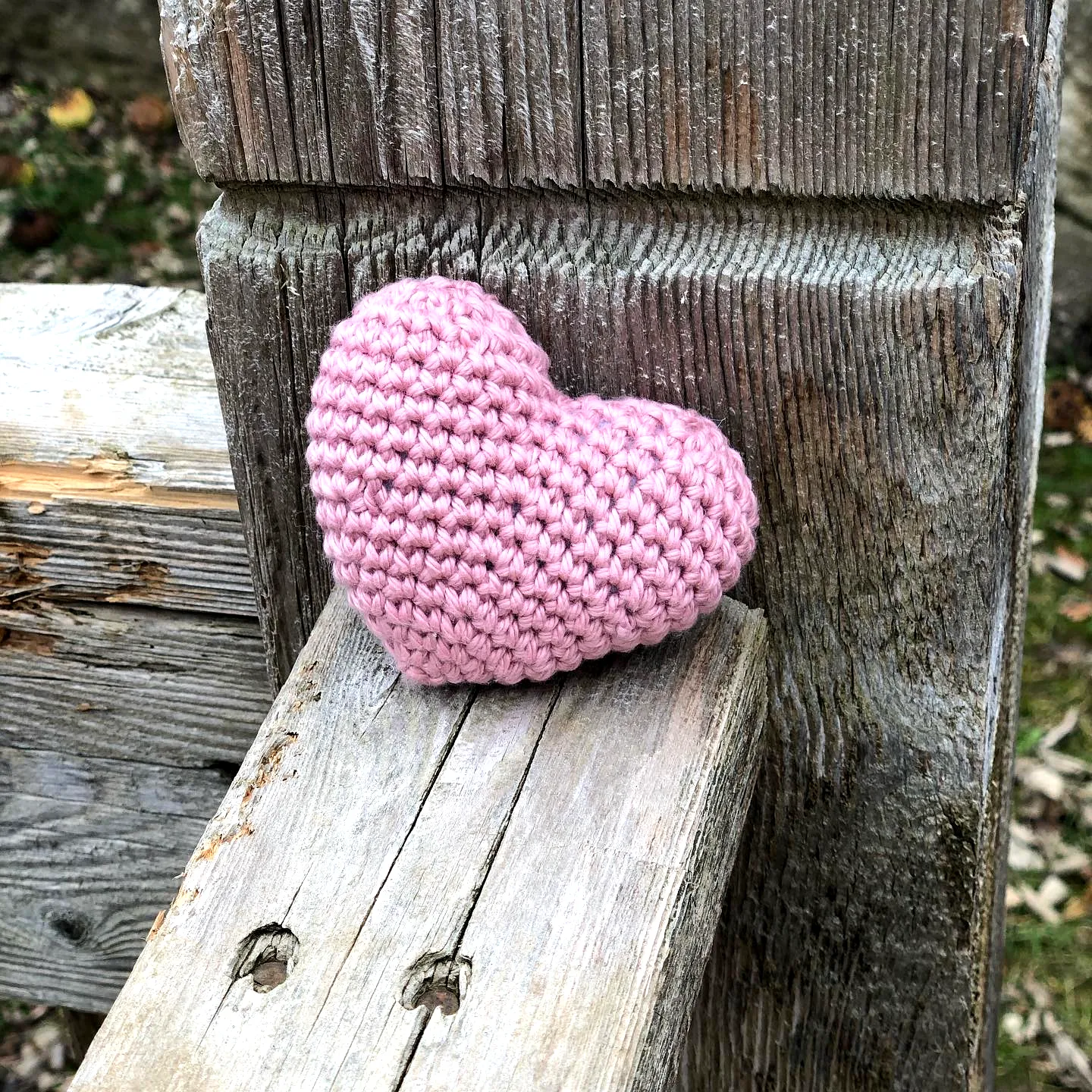 Adorable heart-shaped crochet dog toy in soft pink crochet style