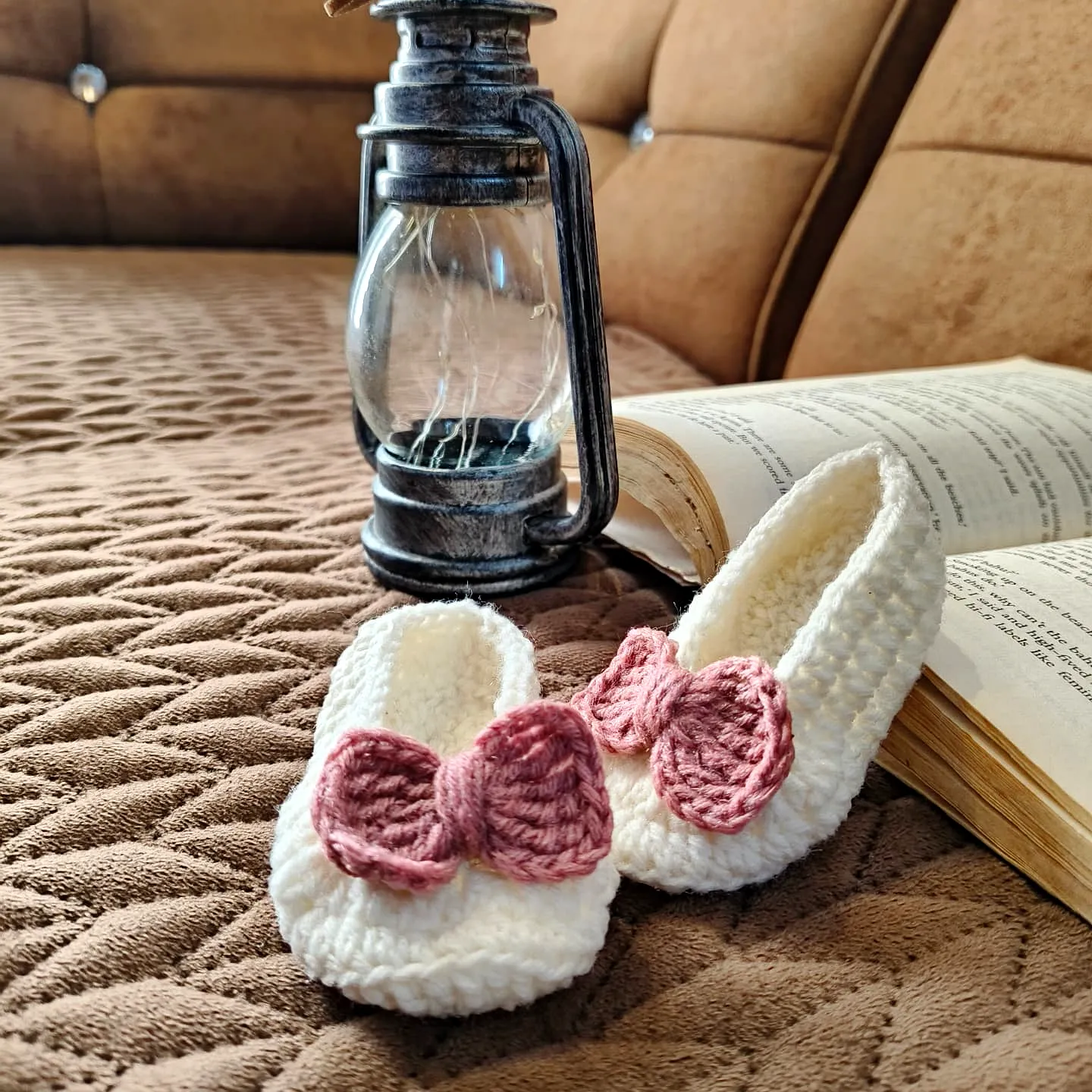 Adorable ivory crochet baby booties with pink bows for beginners