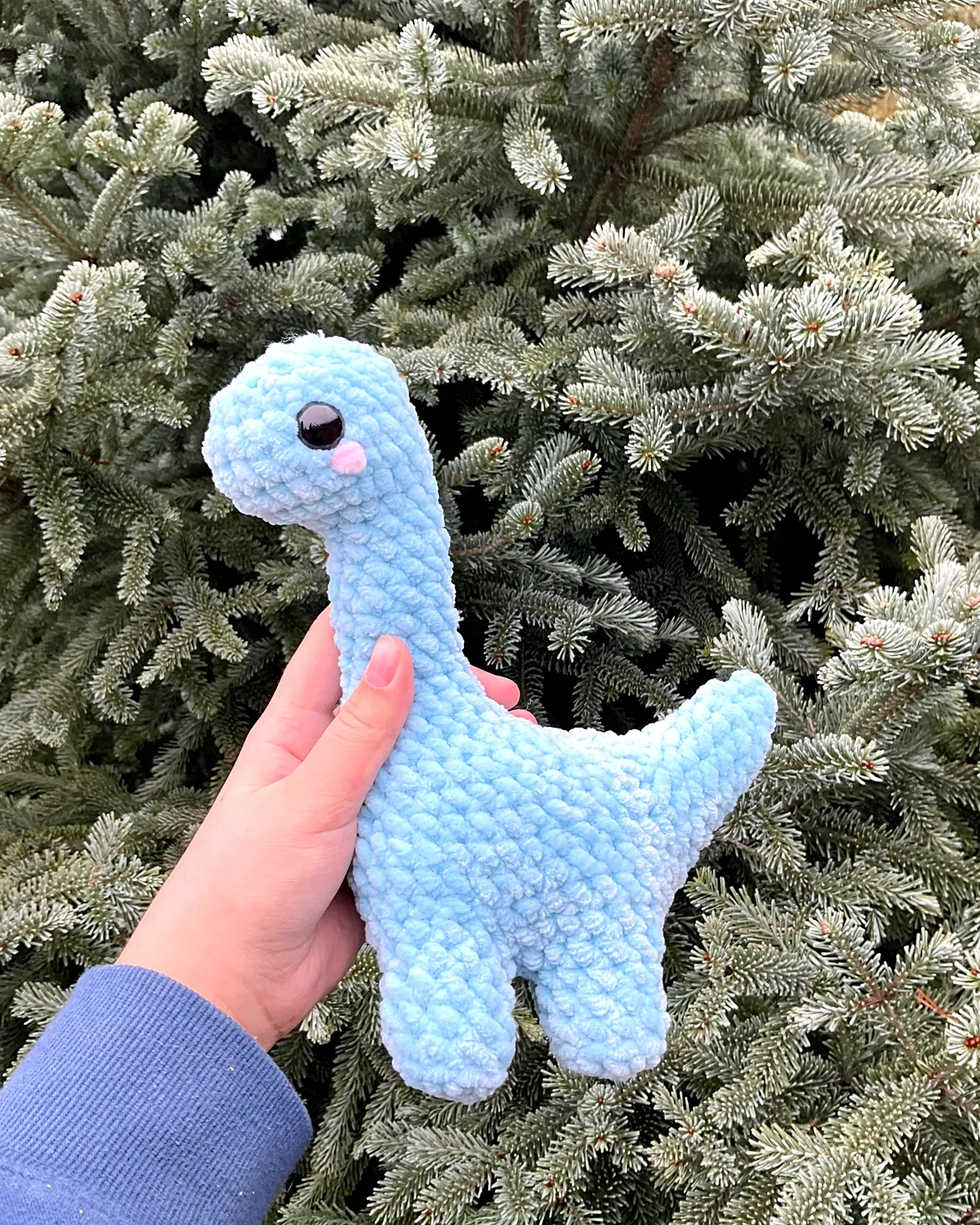 Adorable light blue crochet dinosaur plush toy