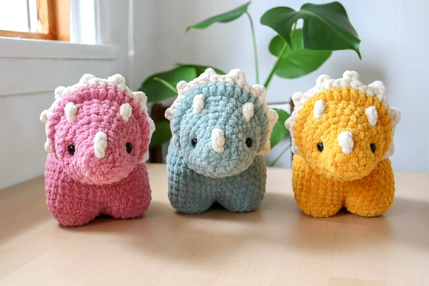 Adorable pastel crochet dinosaur soft toy