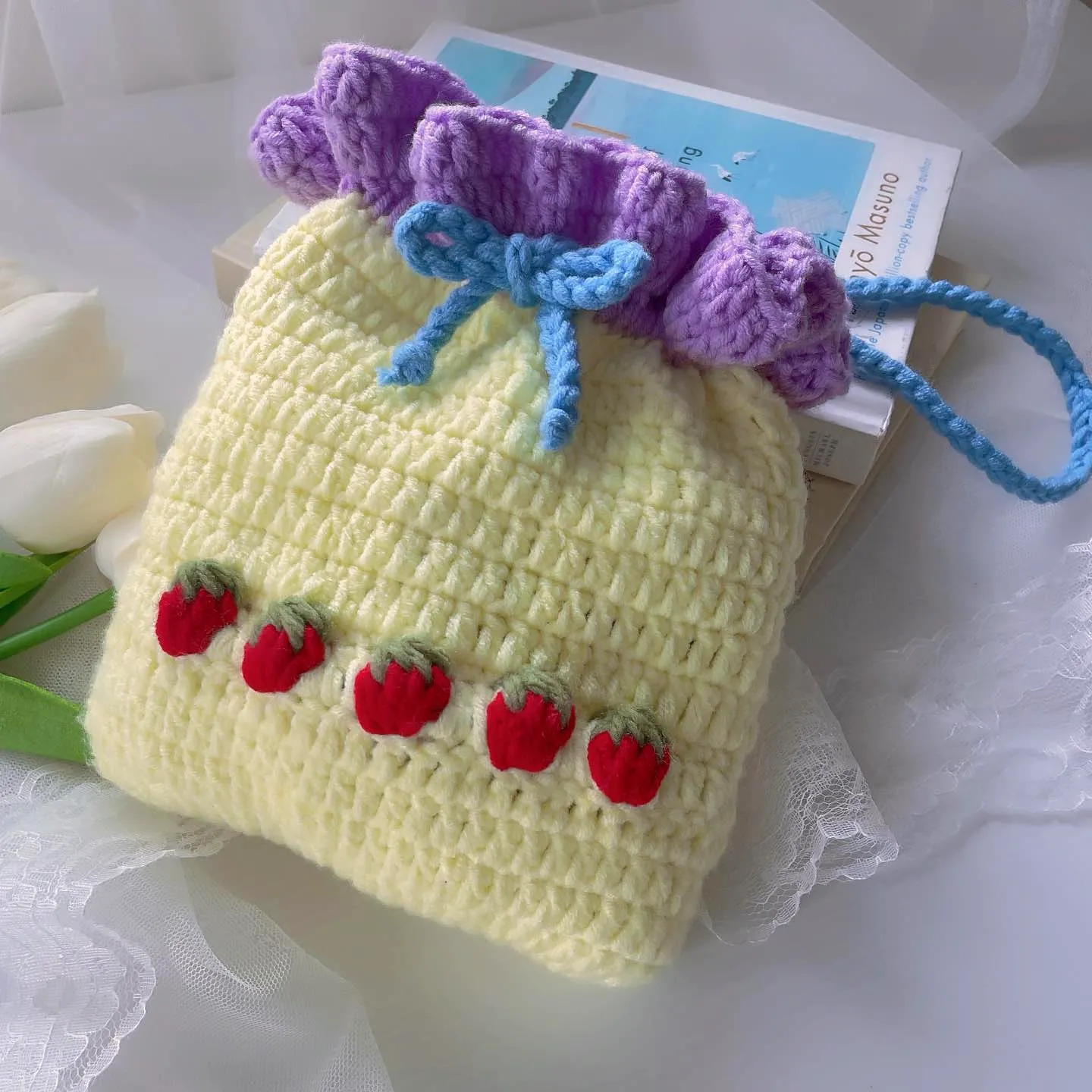 Adorable pastel yellow crochet gift bag with lavender frill