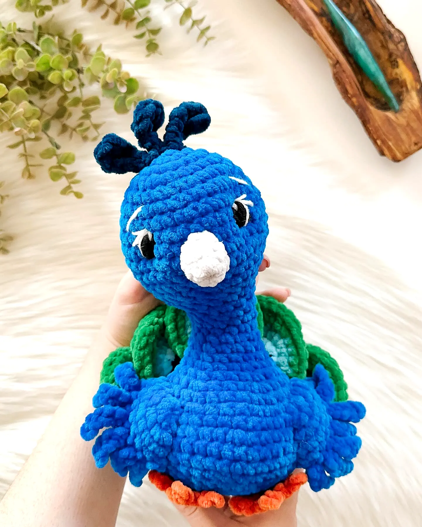 Adorable vibrant crochet bird toy in peacock style for intermediates