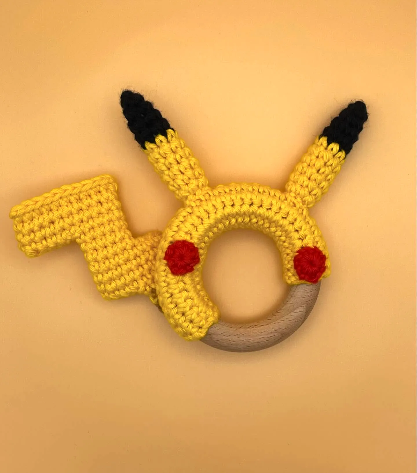 Adorable vibrant crochet teether Pikachu design for babies