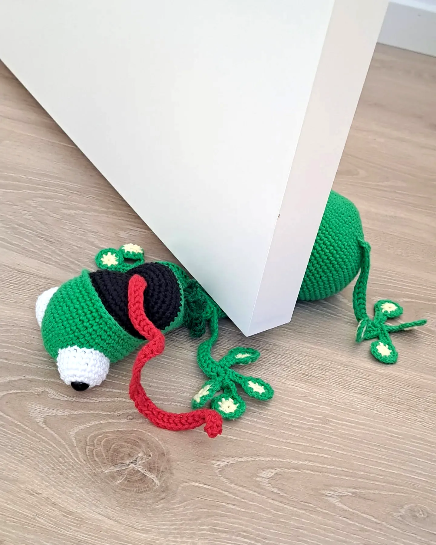 Adorable Vibrant Green Crochet Doorstop Frog with Leaf Details