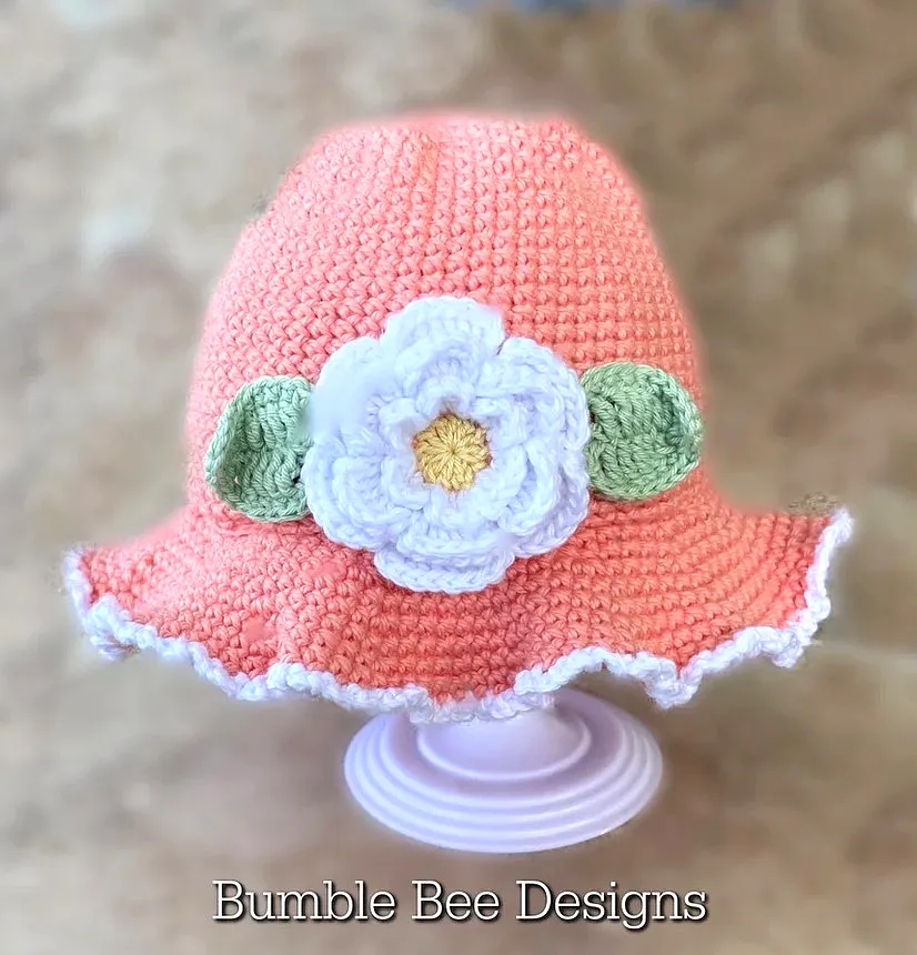Charming Crochet Baby Bonnet in Soft Coral with Floral Design