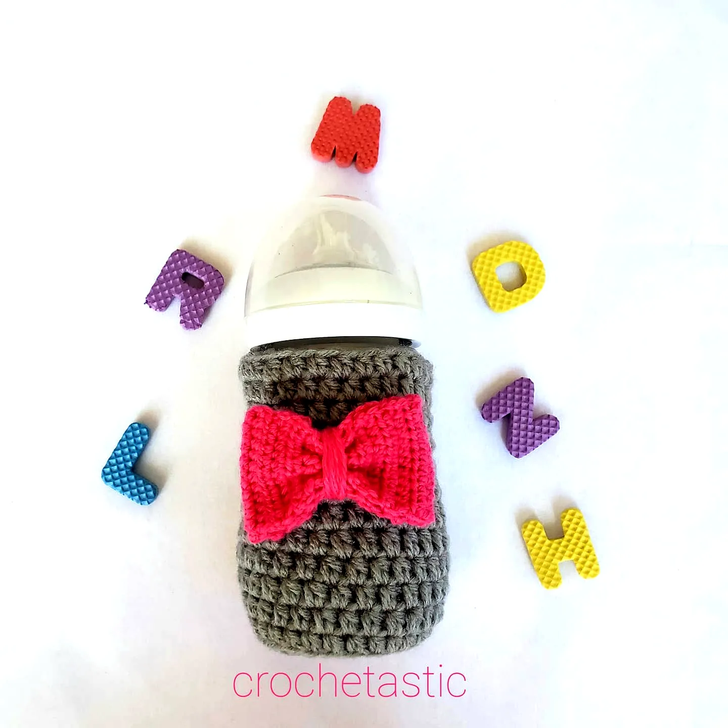 Charming Crochet Baby Bottle Cover in Gray with Pink Bow Tie