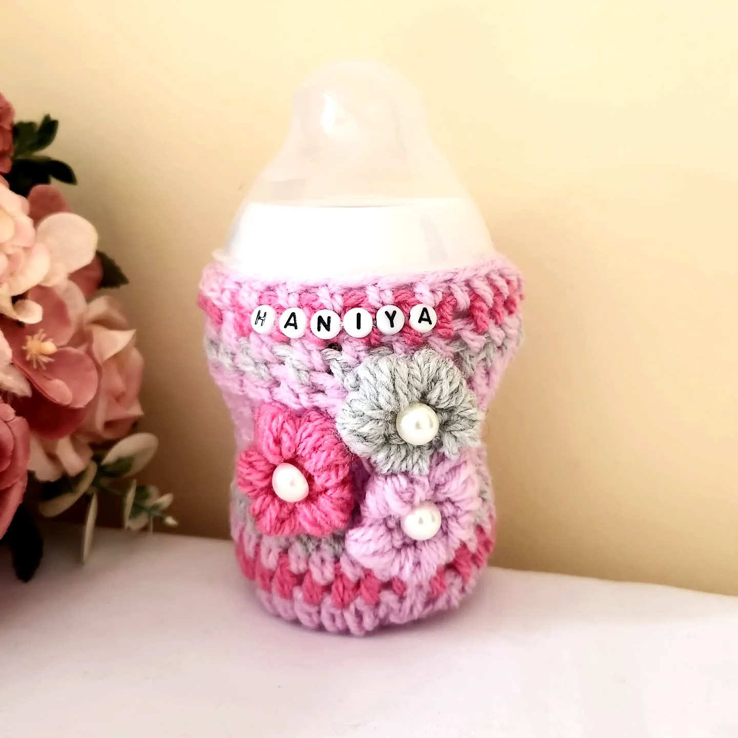 Charming Crochet Baby Bottle Cover in Pastel Pink and Purple