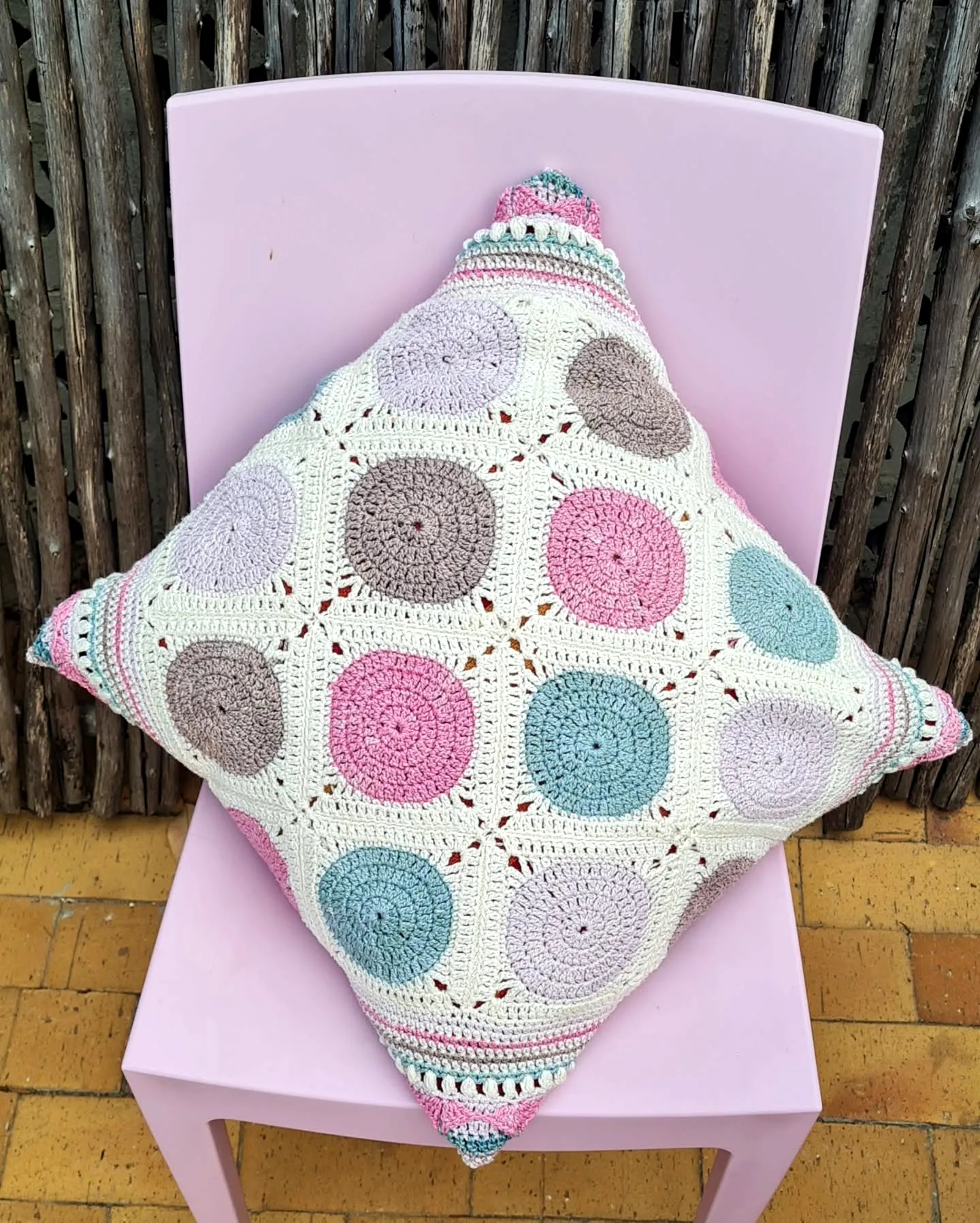 Charming Crochet Cushion with Geometric Design in Pastels
