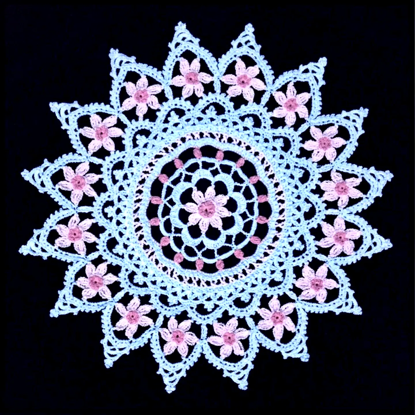 Charming Crochet Doily in Soft Blue and Pink with Star Design