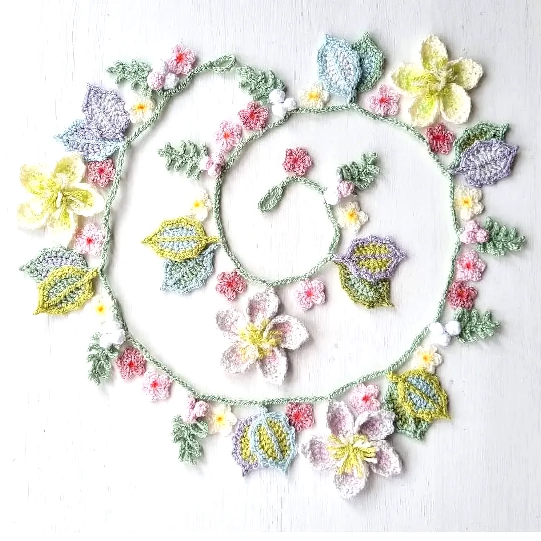 Charming Crochet Garland with Colorful Flowers and Leaves
