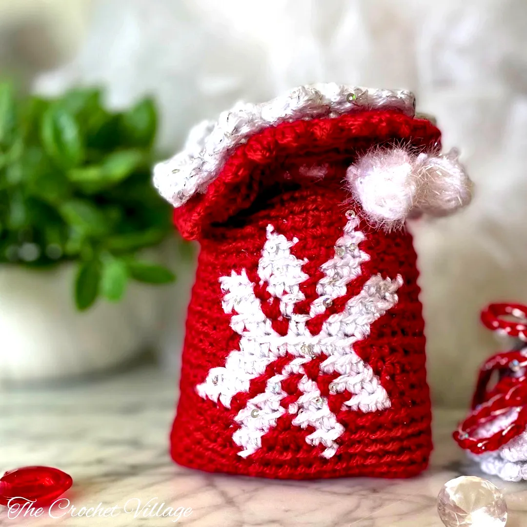 Charming Crochet Gift Bag in Vibrant Red and White with Snowflakes