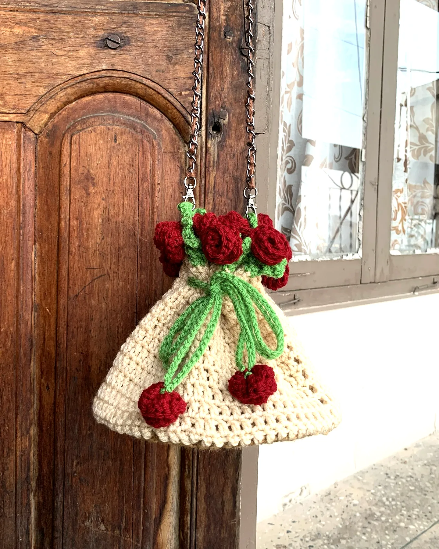 Charming Crochet Gift Bag with Vibrant Roses and Green Leaves