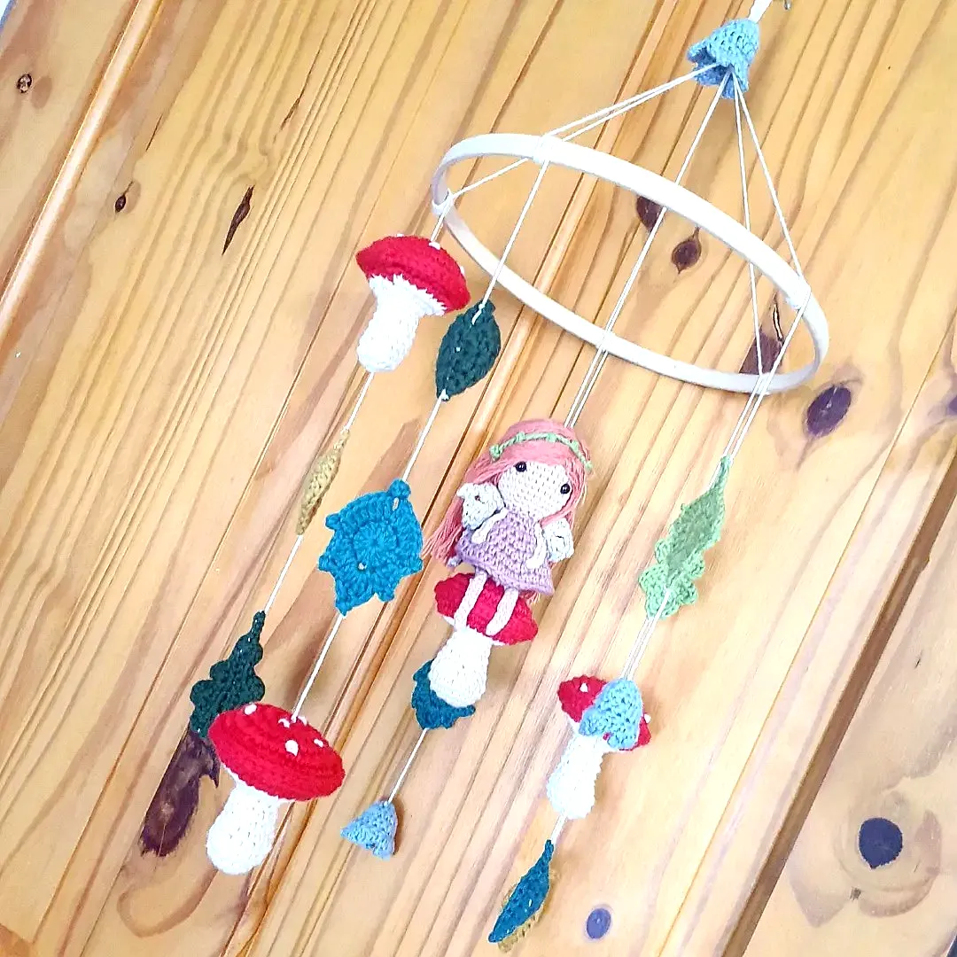 Charming Crochet Nursery Decor with Colorful Mobile Design