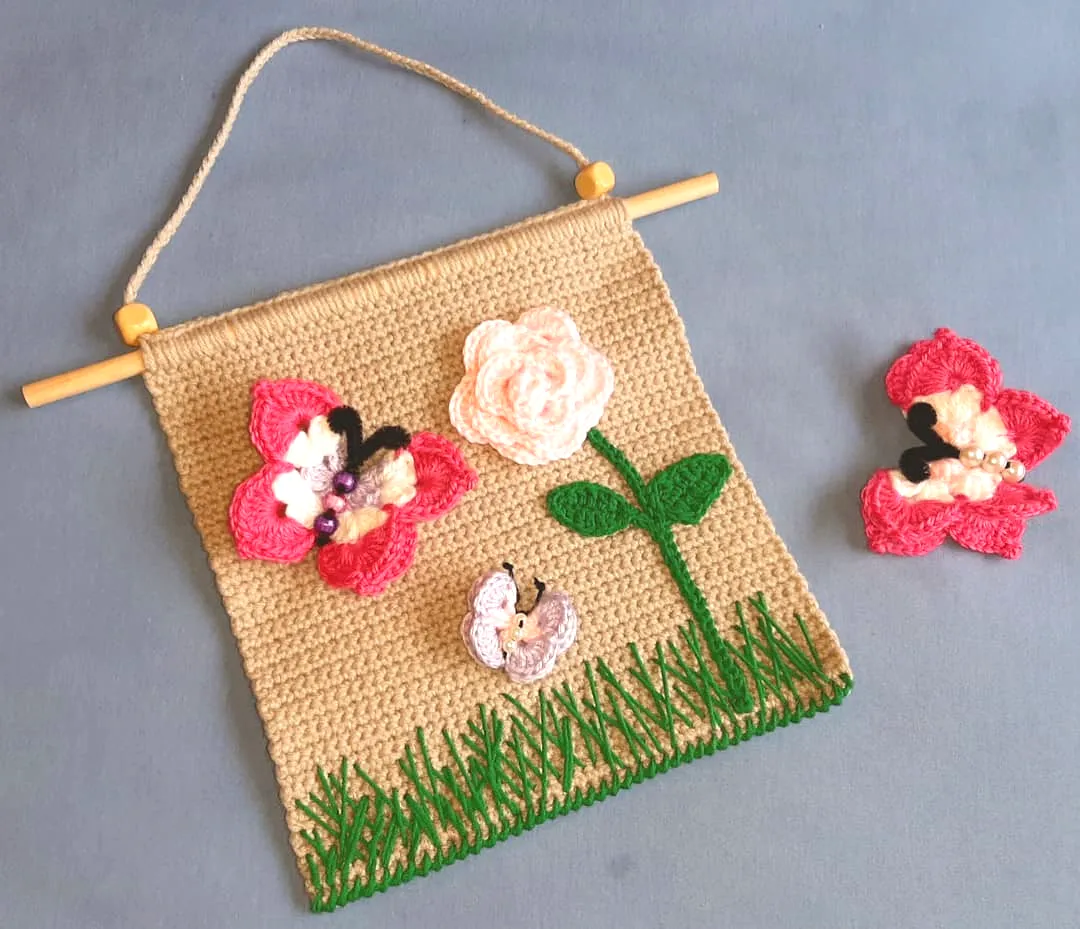 Charming Crochet Wall Decor with Pink and Cream Floral Design