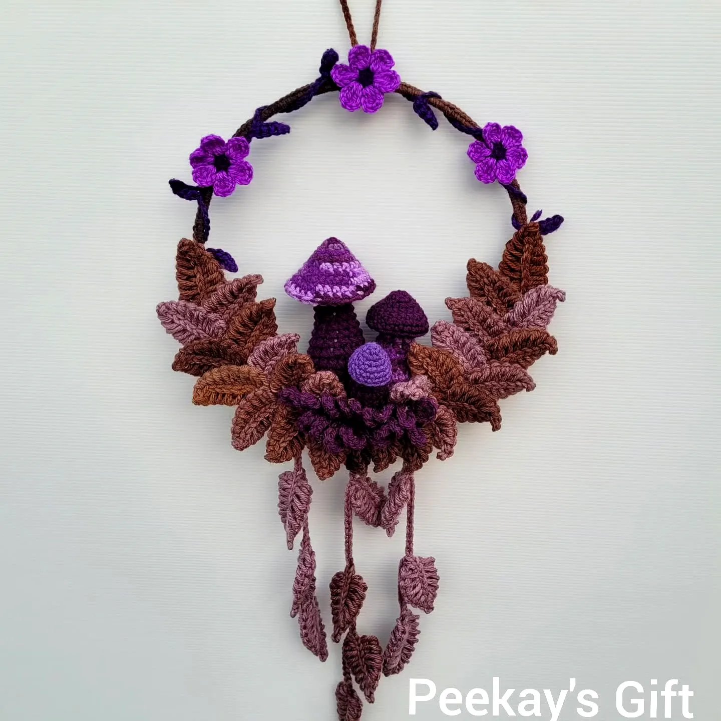 Charming Crochet Wall Decor with Purple Flowers and Mushrooms
