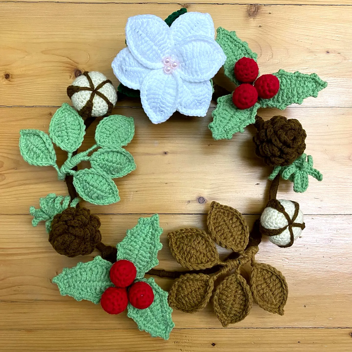 Charming Crochet Wreath with Vibrant Leaves and Red Berries