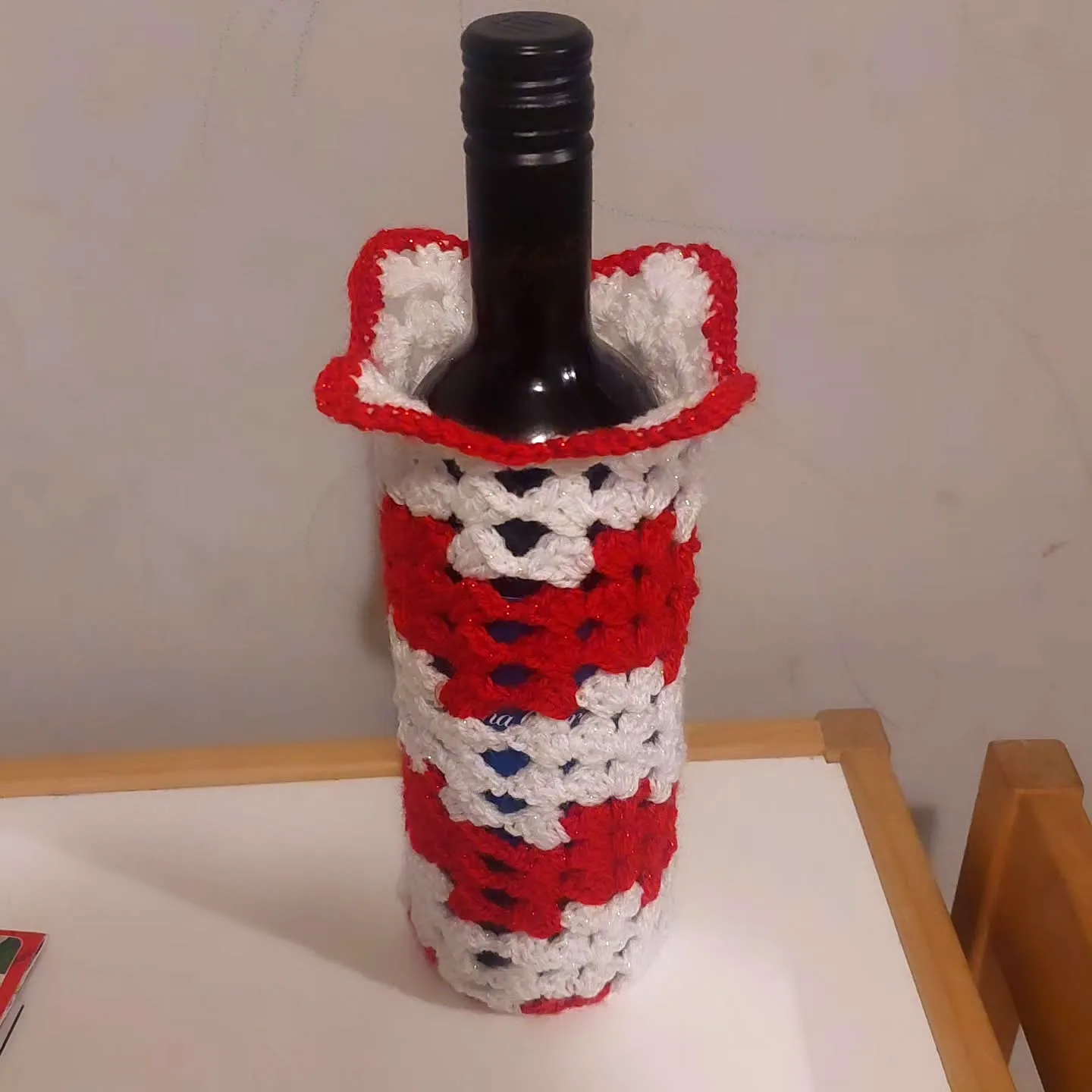 Charming Easy Crochet Bottle Cozy in Red and White Granny Squares
