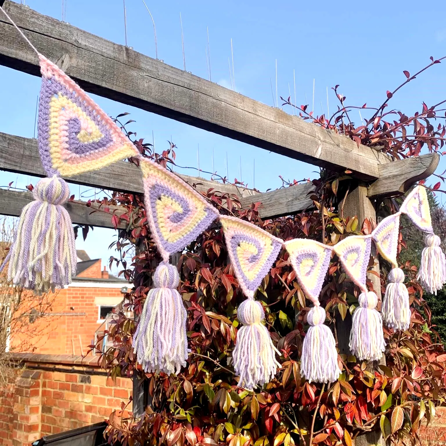 Charming Pastel Crochet Bunting with Fluffy Tassels for Decor