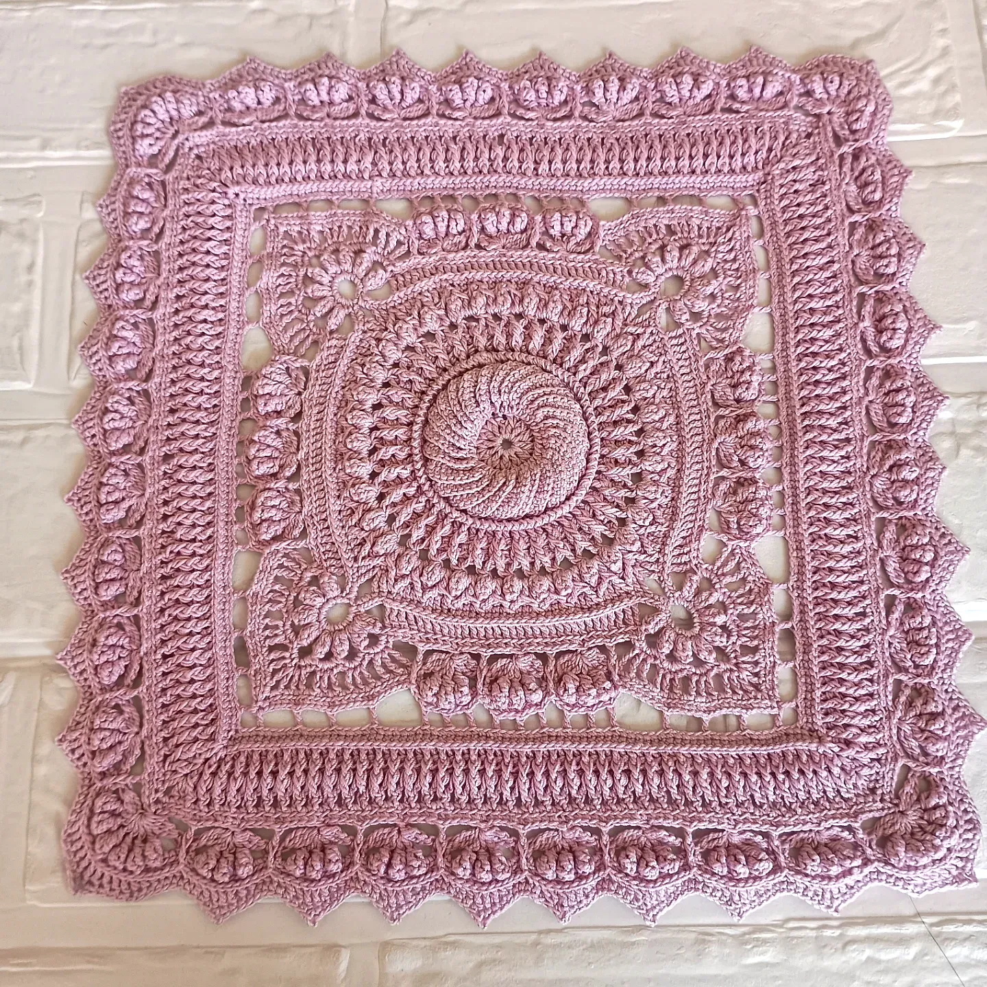Charming Pink Crochet Doily with Intricate Floral Design