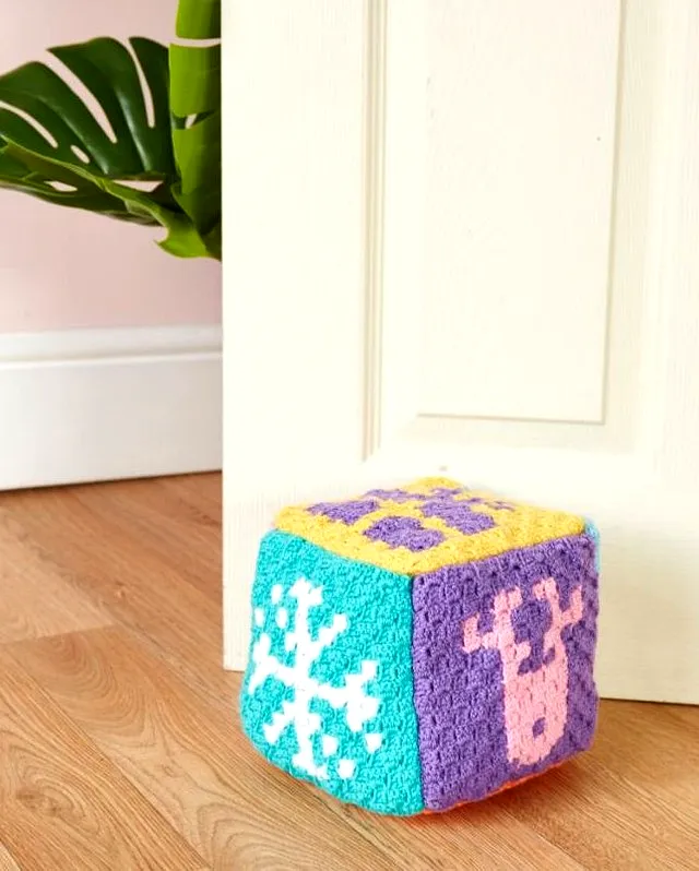 Colorful Crochet Doorstop with Snowflakes and Reindeer Patterns