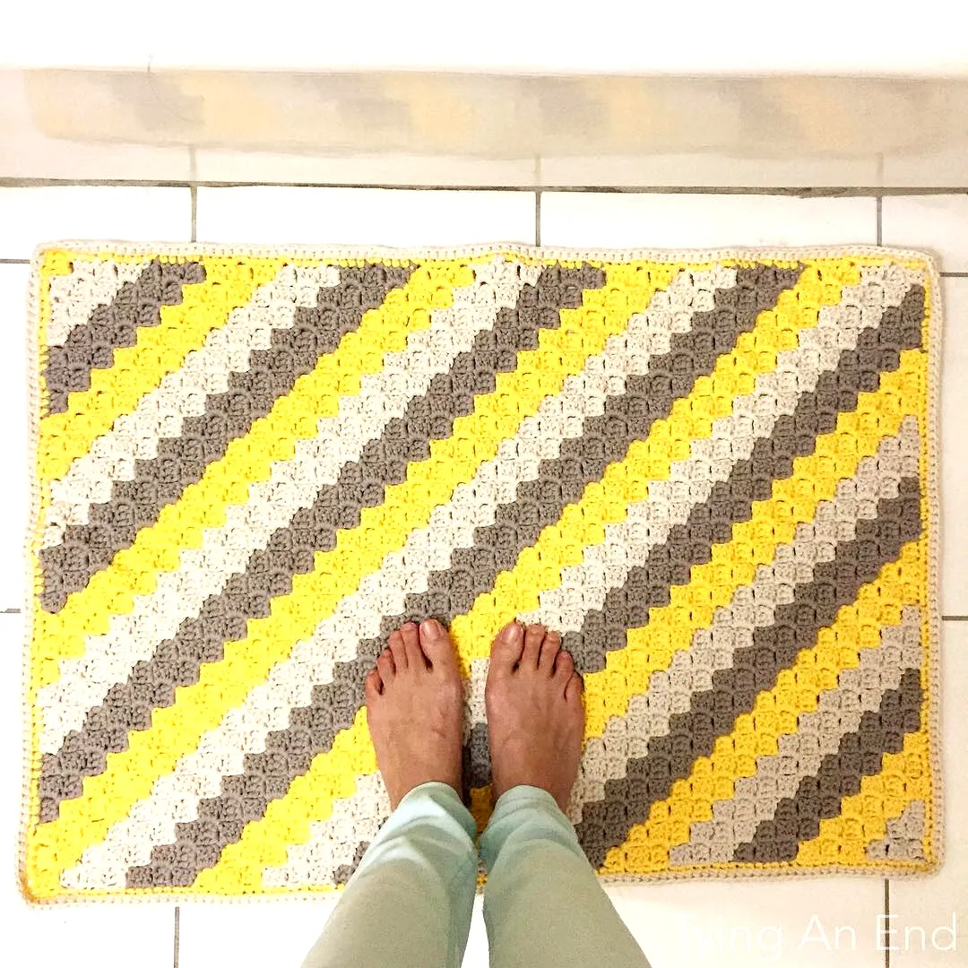 Colorful Crochet Floor Mat with Modern Stripes in Yellow Gray Cream