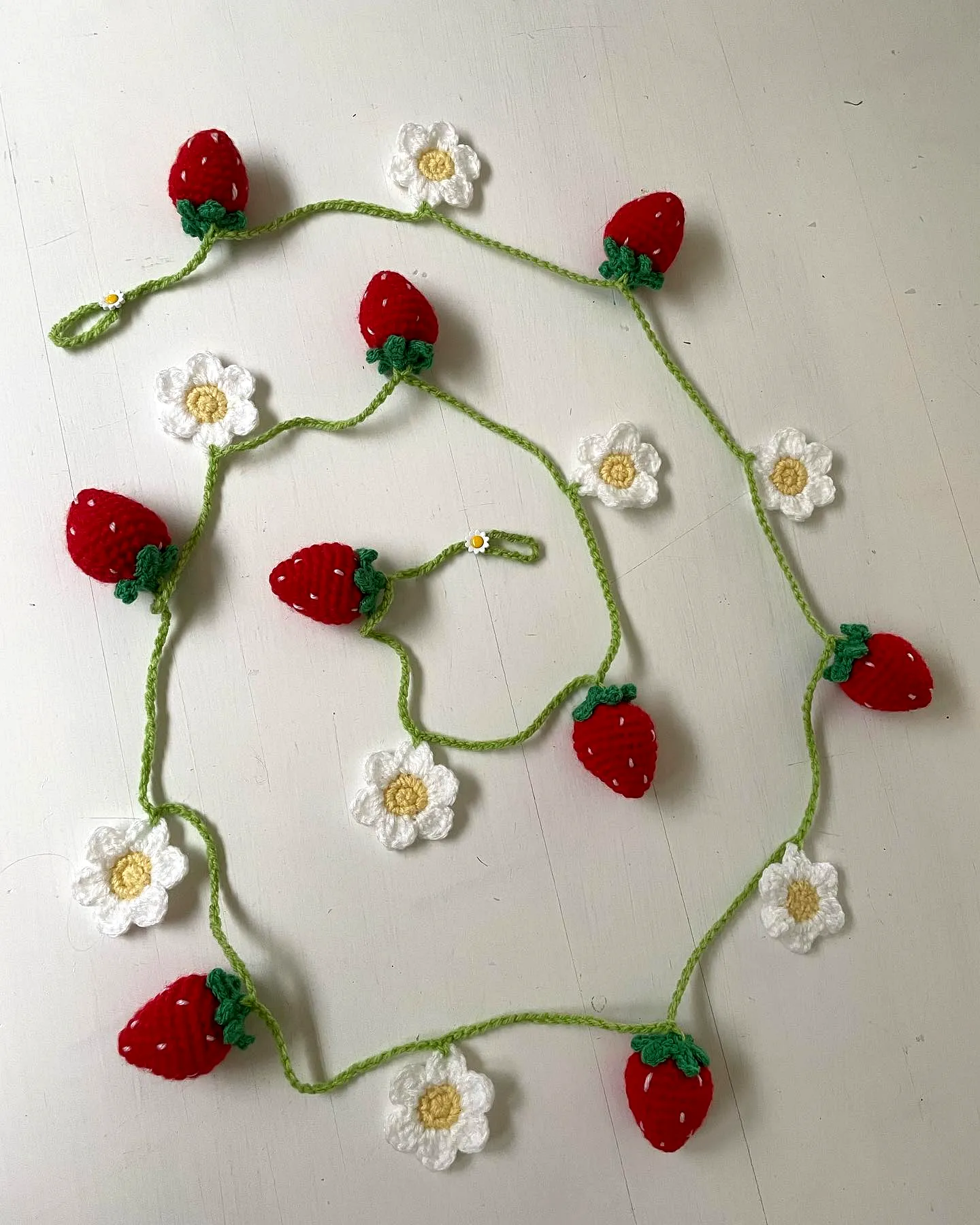 Colorful crochet garland of strawberries and flowers for intermediates