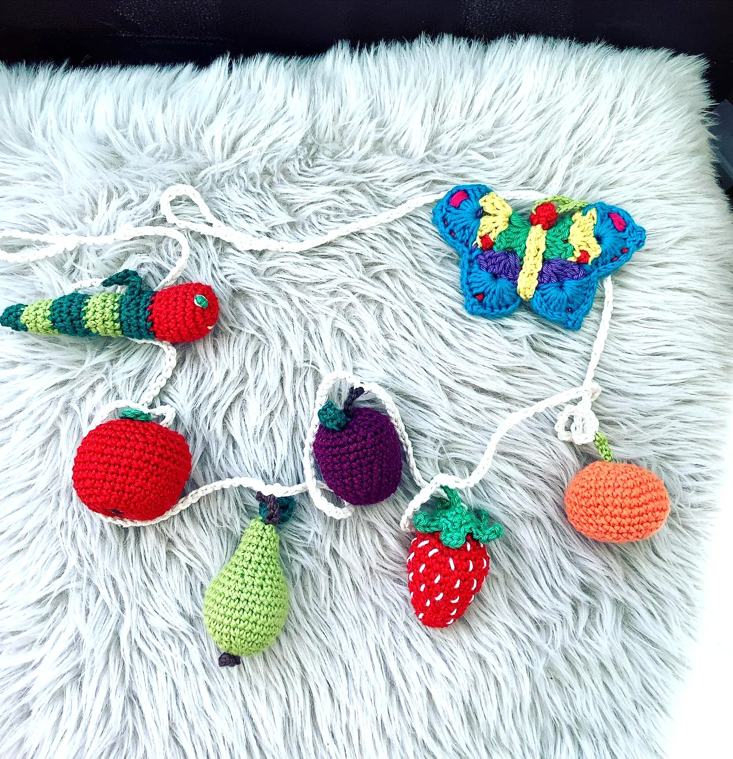 Colorful Crochet Nursery Decor with Fruit and Butterfly Design