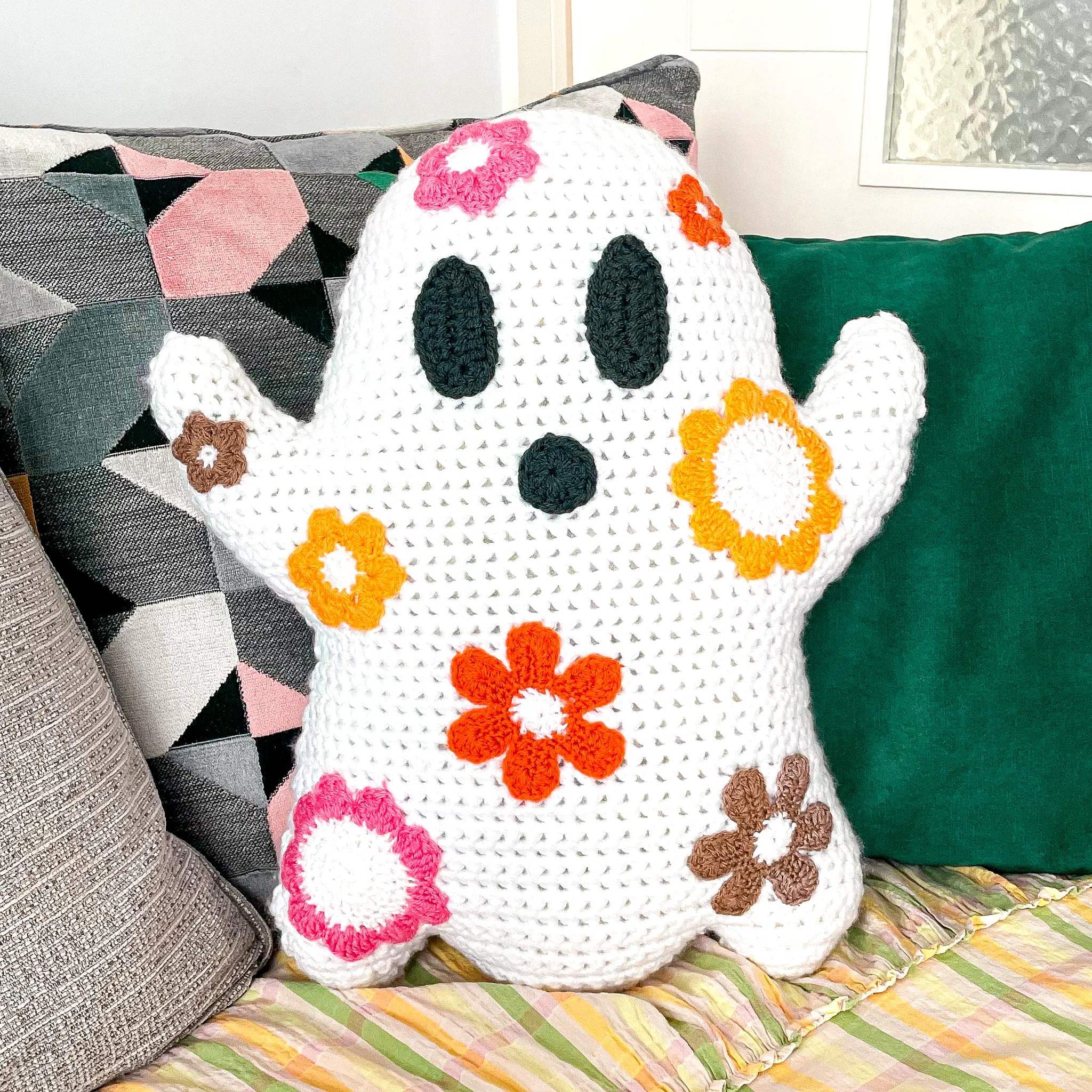 Colorful Crochet Pillow of a Playful Ghost Shape for Cozy Decor