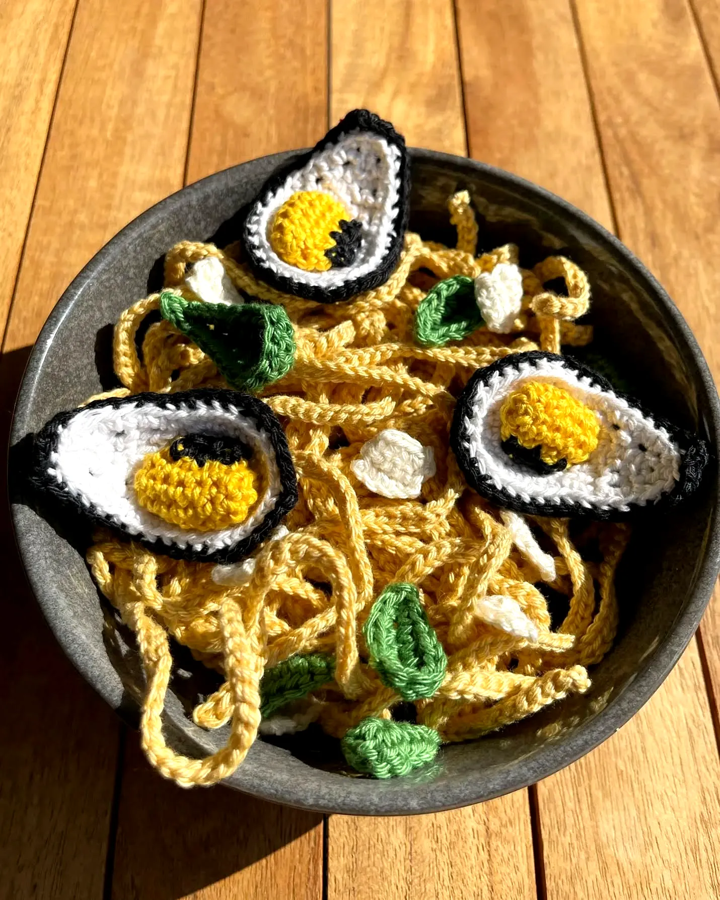 Colorful crochet spaghetti with vibrant toppings