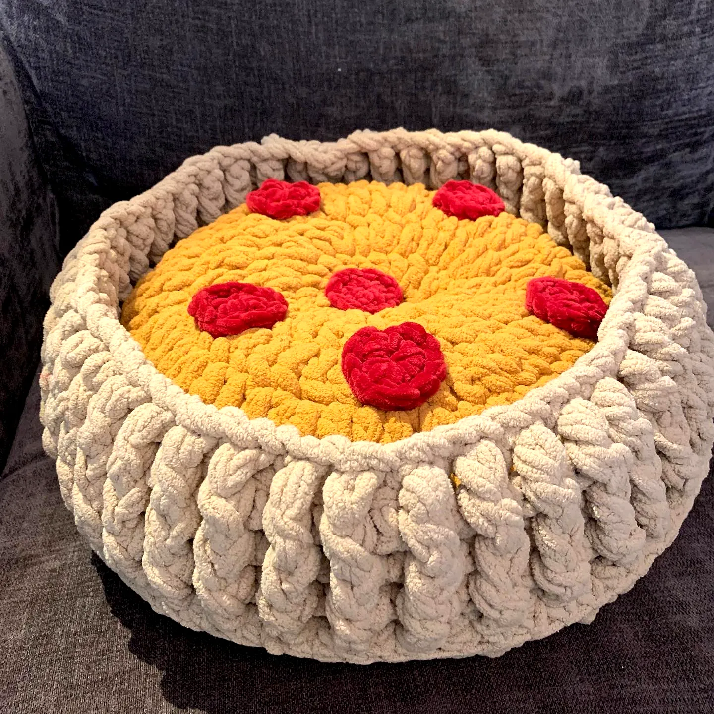Cozy Crochet Pet Bed in Vibrant Yellow with Red Flower Accents